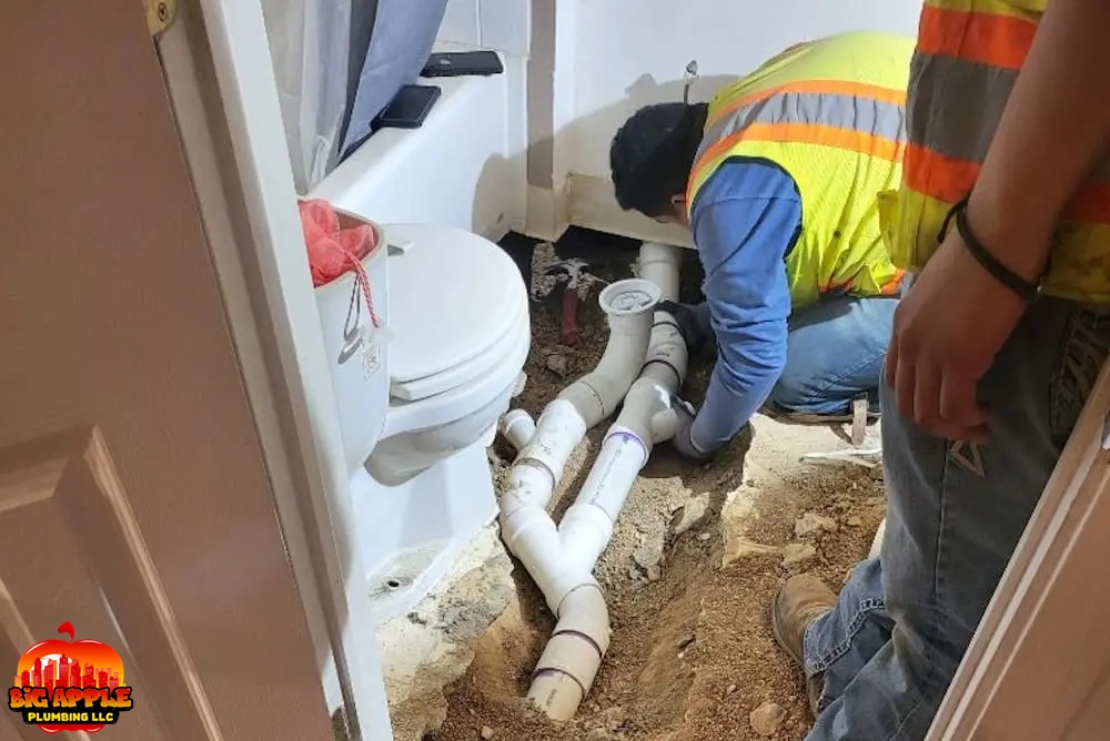 plumbers repairing blocked interior sewer line